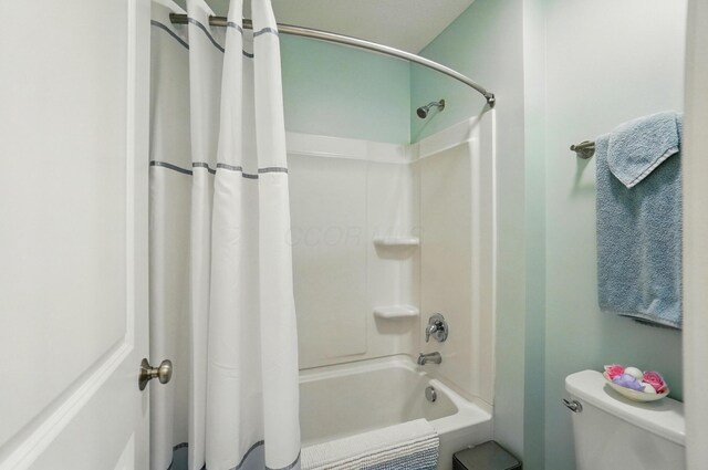 6368 Casado Dr, Columbus, OH 43213 - bathroom with shower / tub combo with curtain and toilet