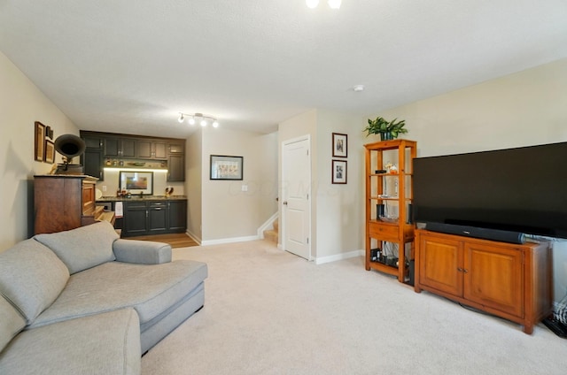 6368 Casado Dr, Columbus, OH 43213 - living room with stairs, light carpet, bar, and baseboards