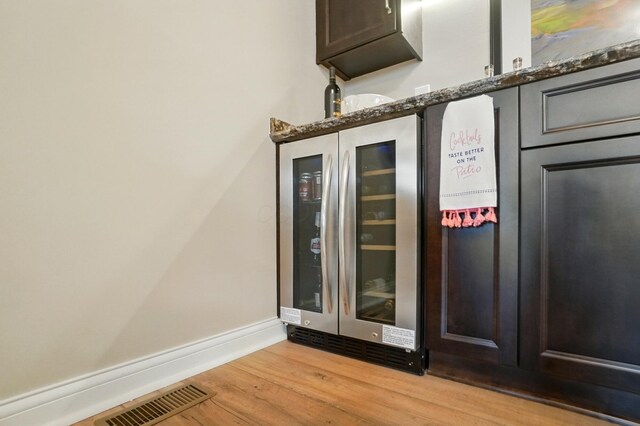 6368 Casado Dr, Columbus, OH 43213 - detailed view of beverage cooler, wood finished floors, and baseboards