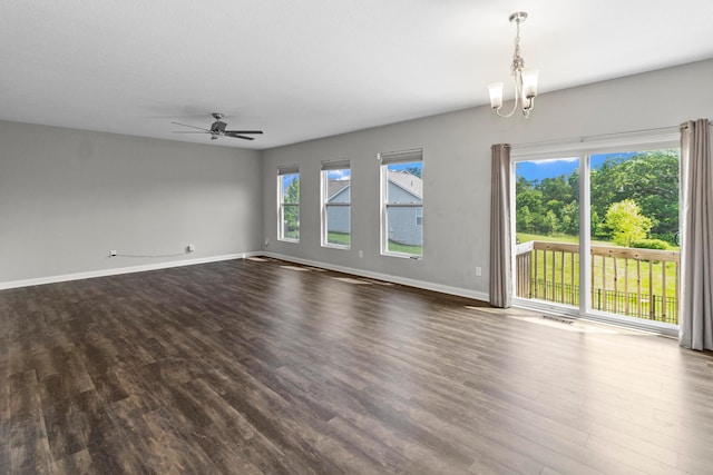 3015 Green Line Way, Columbus, OH 43231 - unfurnished room featuring dark wood-style floors, a chandelier, a ceiling fan, and baseboards