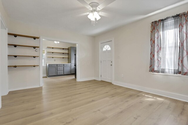 115 N Walnut St, Baltimore, OH 43105 - foyer with light wood-type flooring, ceiling fan, and baseboards