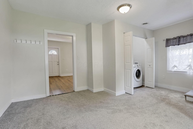 115 N Walnut St, Baltimore, OH 43105 - laundry room featuring washer / dryer, carpet floors, healthy amount of natural light, baseboards, and a textured ceiling