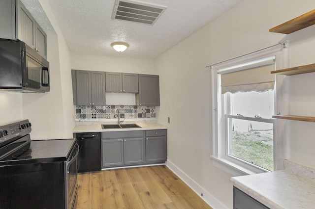115 N Walnut St, Baltimore, OH 43105 - kitchen featuring black appliances, open shelves, a sink, gray cabinetry, and a textured ceiling