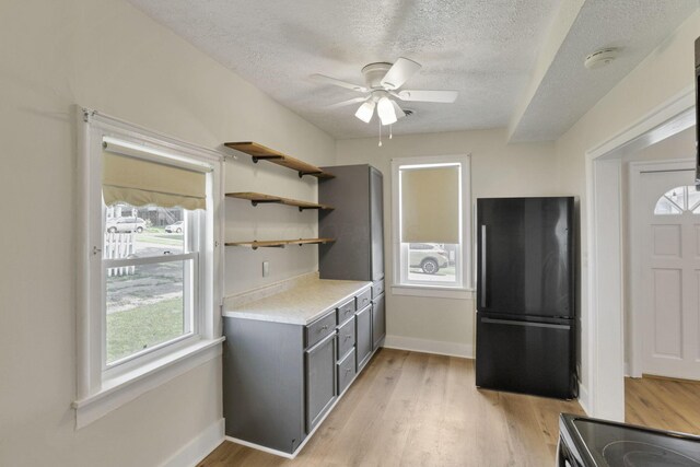 115 N Walnut St, Baltimore, OH 43105 - kitchen with freestanding refrigerator, gray cabinetry, a textured ceiling, light countertops, and ceiling fan