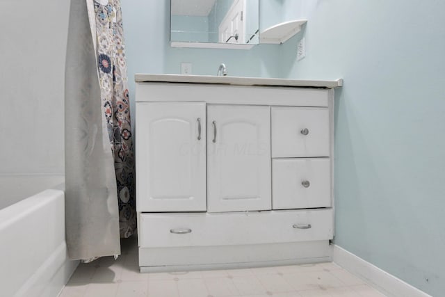 115 N Walnut St, Baltimore, OH 43105 - full bath with vanity, tile patterned floors, baseboards, and shower / tub combo