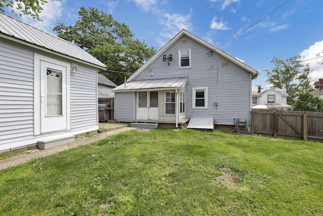 115 N Walnut St, Baltimore, OH 43105 - back of property featuring metal roof, a gate, and entry steps