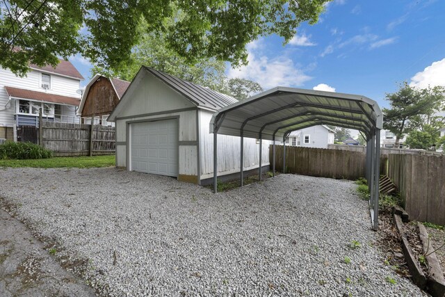 115 N Walnut St, Baltimore, OH 43105 - detached garage featuring gravel driveway and a carport