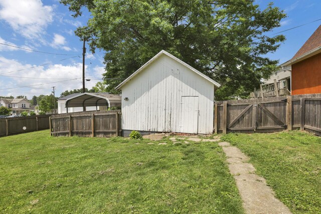 115 N Walnut St, Baltimore, OH 43105 - view of shed with a detached carport and a gate