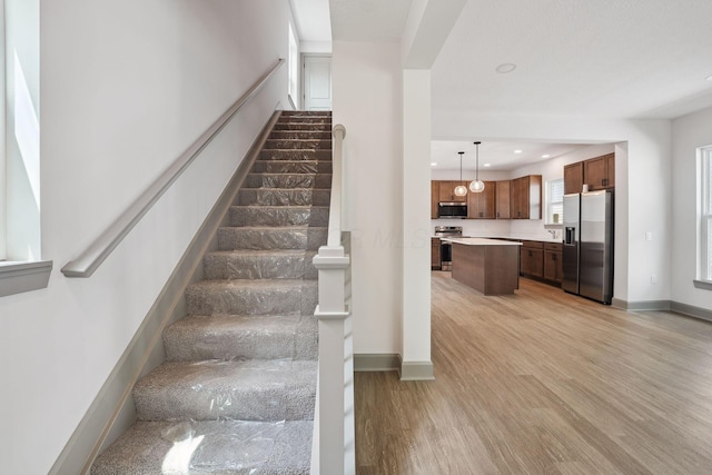 63 Hayden Ave, Columbus, OH 43222 - staircase featuring wood finished floors and recessed lighting
