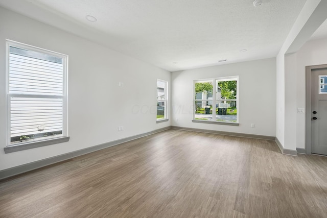 63 Hayden Ave, Columbus, OH 43222 - unfurnished room with wood finished floors and baseboards