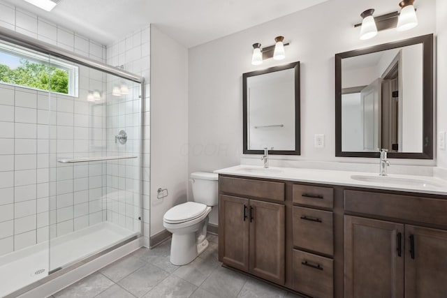 63 Hayden Ave, Columbus, OH 43222 - full bathroom with a shower stall, double vanity, and tile patterned floors