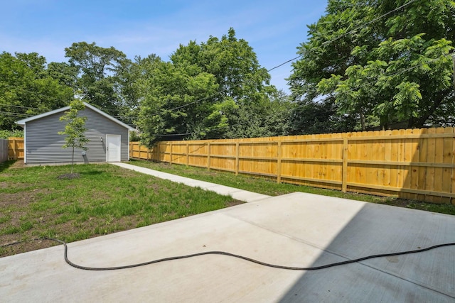 63 Hayden Ave, Columbus, OH 43222 - fenced backyard with a patio area and an outbuilding