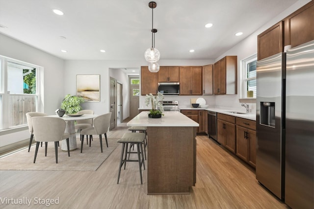 63 Hayden Ave, Columbus, OH 43222 - kitchen with stainless steel appliances, light wood-style flooring, light countertops, plenty of natural light, and recessed lighting