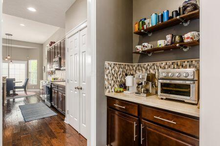 1201 Stone Trail Dr, Blacklick, OH 43004 - bar with dark wood-style flooring, recessed lighting, hanging light fixtures, and backsplash
