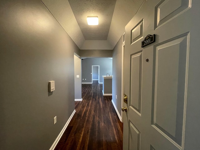 2001 Berrancher Dr, Columbus, OH 43228 - corridor with dark wood-style flooring, baseboards, and a textured ceiling
