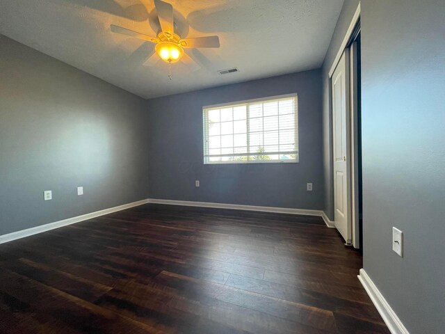 2001 Berrancher Dr, Columbus, OH 43228 - spare room with ceiling fan, dark wood-style floors, and baseboards