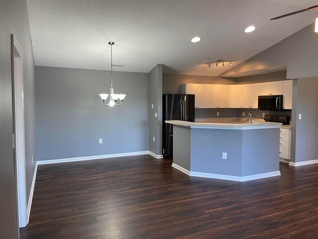 2001 Berrancher Dr, Columbus, OH 43228 - kitchen with black microwave, freestanding refrigerator, a chandelier, dark wood-style flooring, and white cabinetry