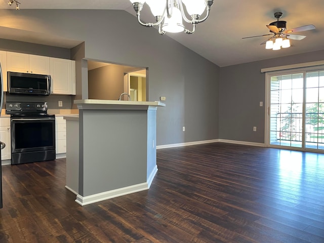 2001 Berrancher Dr, Columbus, OH 43228 - kitchen featuring black range with electric cooktop, vaulted ceiling, light countertops, dark wood-style floors, and baseboards