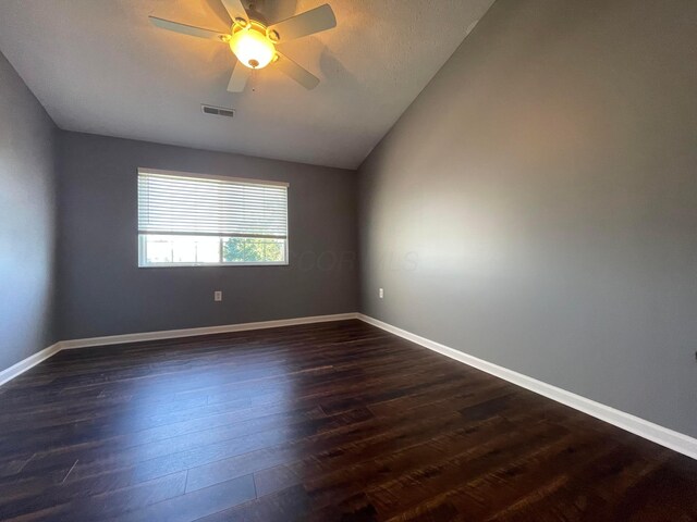 2001 Berrancher Dr, Columbus, OH 43228 - spare room featuring dark wood-style floors, vaulted ceiling, ceiling fan, and baseboards