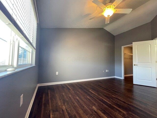 2001 Berrancher Dr, Columbus, OH 43228 - spare room with dark wood-style floors, a ceiling fan, lofted ceiling, and baseboards