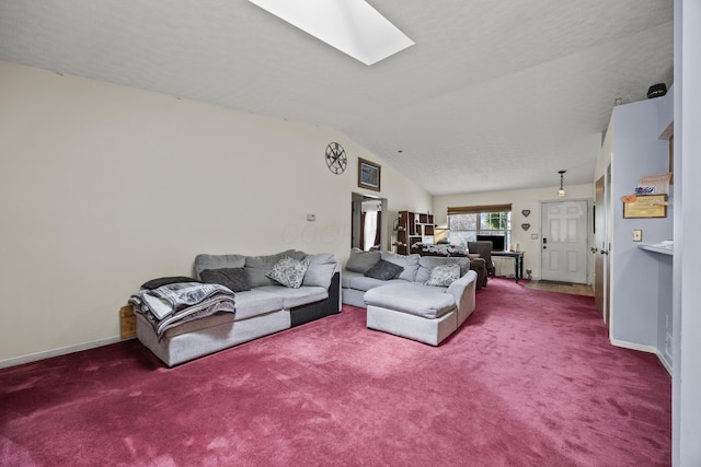 993 Esther Dr, Columbus, OH 43207 - carpeted living room featuring a skylight, baseboards, and lofted ceiling