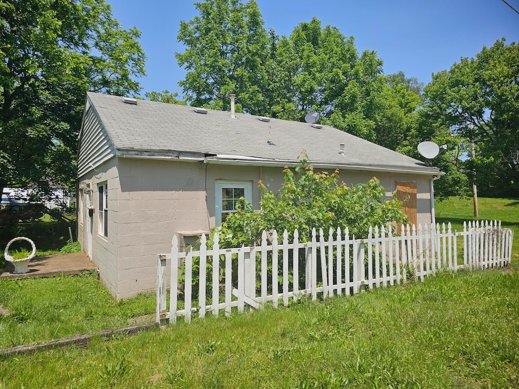1000 Goodwin Ave, Lancaster, OH 43130 - view of property exterior with a shingled roof and concrete block siding