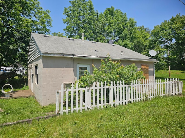 1000 Goodwin Ave, Lancaster, OH 43130 - view of property exterior with a shingled roof and concrete block siding