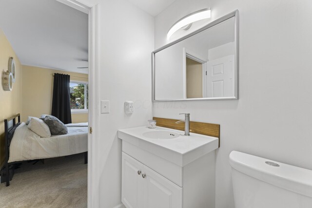 6576 Creon Dr, Reynoldsburg, OH 43068 - half bath with vanity, toilet, and connected bathroom