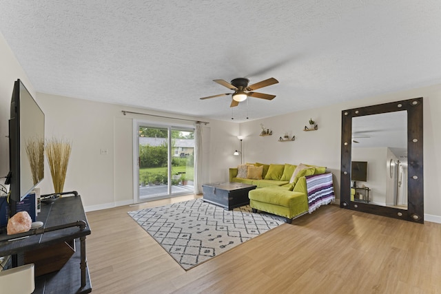 6576 Creon Dr, Reynoldsburg, OH 43068 - living area featuring ceiling fan, wood finished floors, baseboards, and a textured ceiling