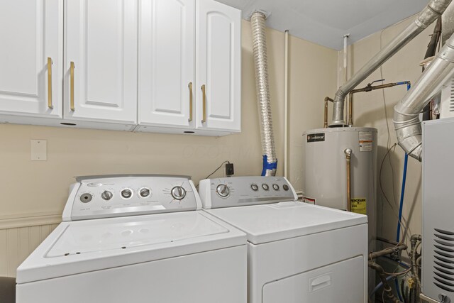 6576 Creon Dr, Reynoldsburg, OH 43068 - laundry area featuring washing machine and dryer, gas water heater, cabinet space, and wainscoting