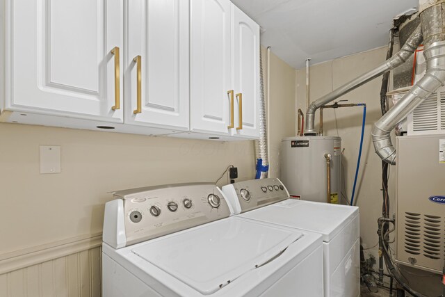 6576 Creon Dr, Reynoldsburg, OH 43068 - laundry room featuring gas water heater, washer and dryer, and cabinet space