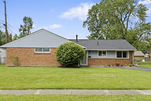 6576 Creon Dr, Reynoldsburg, OH 43068 - ranch-style house with brick siding, a front yard, and a shingled roof