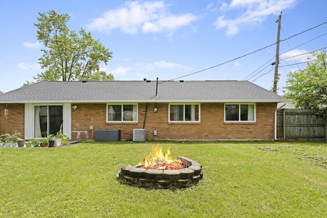 6576 Creon Dr, Reynoldsburg, OH 43068 - rear view of house with a fire pit, central air condition unit, brick siding, and a shingled roof
