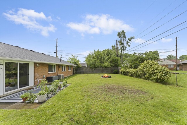 6576 Creon Dr, Reynoldsburg, OH 43068 - view of yard with an outdoor fire pit and central AC unit