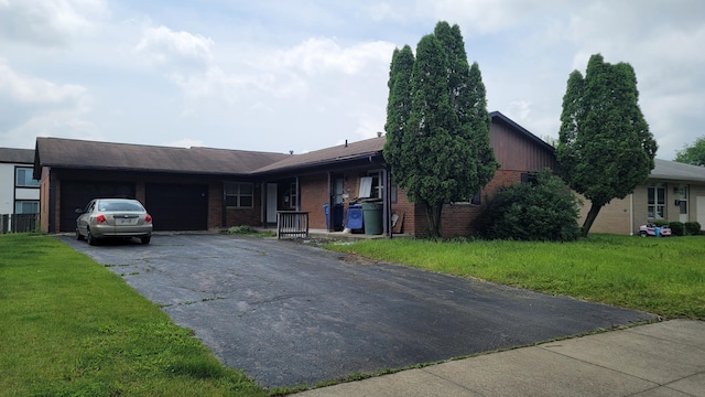 1863-1865 Hampstead Dr Unit 1863, Columbus, OH 43229 - single story home featuring brick siding, an attached garage, driveway, and a front yard