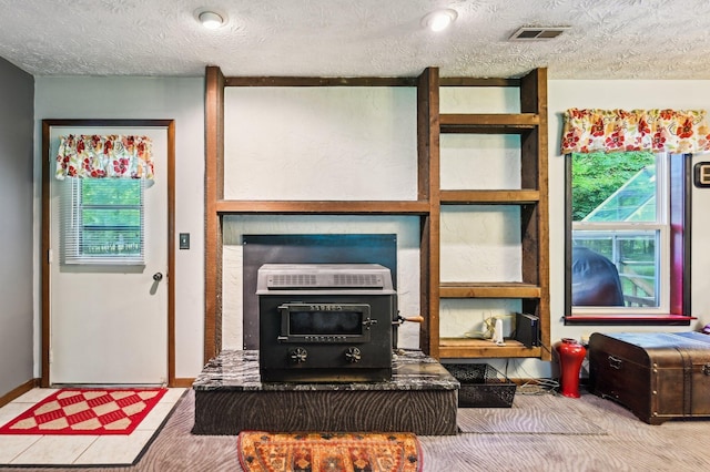 6769 Thoreau Ln NE, Baltimore, OH 43105 - living area featuring a textured ceiling and baseboards