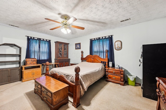 6769 Thoreau Ln NE, Baltimore, OH 43105 - bedroom with light colored carpet, a textured ceiling, and ceiling fan