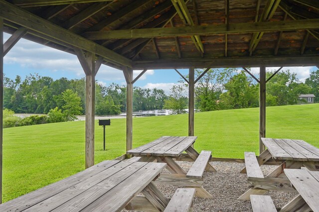 6769 Thoreau Ln NE, Baltimore, OH 43105 - view of patio / terrace with a water view and view of wooded area