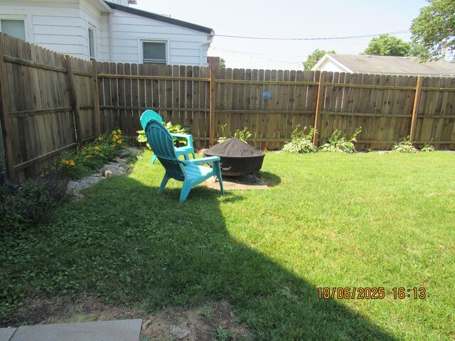 603 N Court St, Circleville, OH 43113 - fenced backyard with an outdoor fire pit