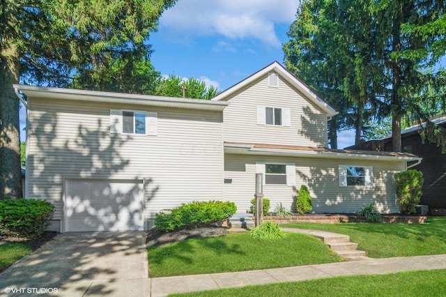 823 S Walnut St, Bucyrus, OH 44820 - traditional-style home featuring a garage, driveway, and a front lawn