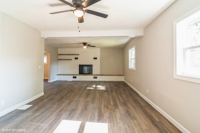 823 S Walnut St, Bucyrus, OH 44820 - unfurnished living room featuring ceiling fan, baseboards, wood finished floors, and a glass covered fireplace