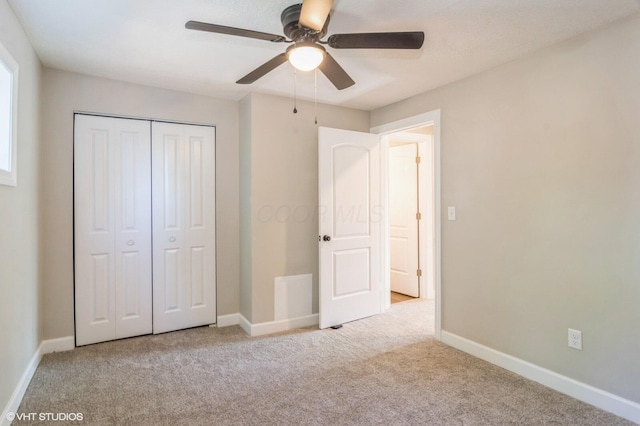 823 S Walnut St, Bucyrus, OH 44820 - unfurnished bedroom featuring carpet, a closet, baseboards, and a ceiling fan