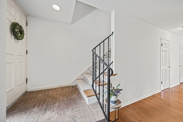 3600 Reed Rd Unit 13, Columbus, OH 43220 - foyer featuring baseboards, stairs, and brick patterned floors