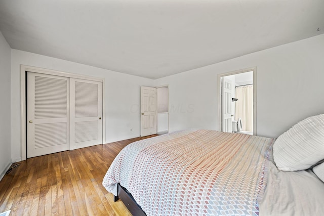 3600 Reed Rd Unit 13, Columbus, OH 43220 - bedroom featuring hardwood / wood-style flooring, a closet, and baseboards