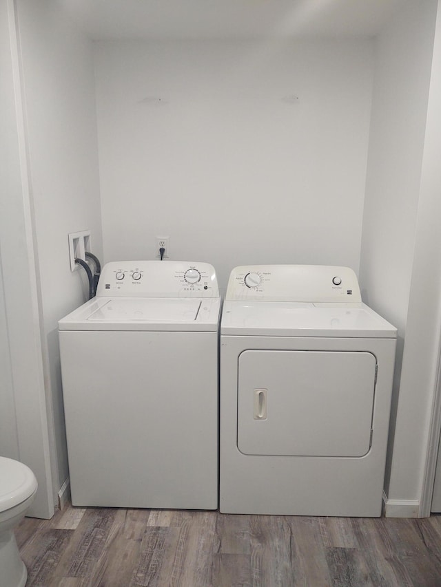 71 Knollwood Ct, South Bloomfield, OH 43103 - laundry area featuring washer and dryer and wood finished floors