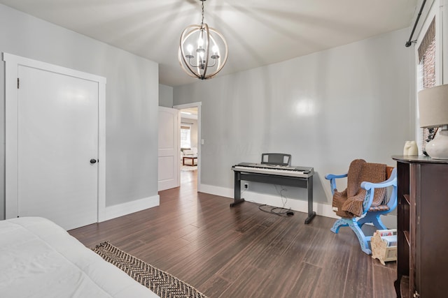 610 Chestnut St, Dresden, OH 43821 - bedroom with a chandelier and wood finished floors