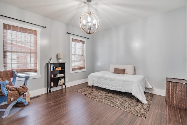 610 Chestnut St, Dresden, OH 43821 - bedroom featuring a chandelier and wood finished floors