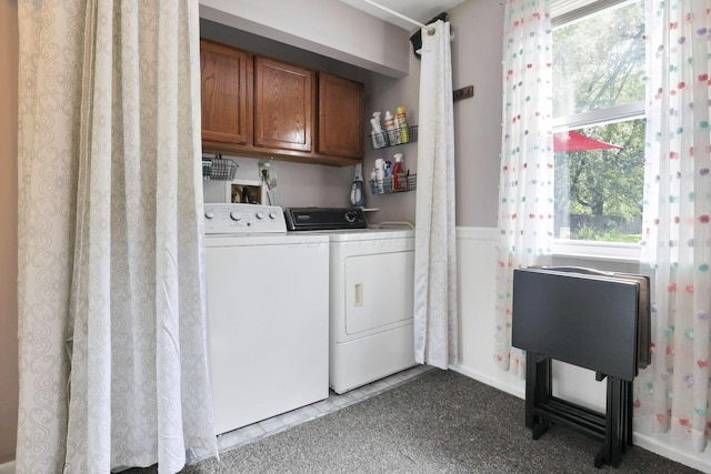 6769 Hildreth Ave, Columbus, OH 43229 - washroom featuring cabinet space, washer and clothes dryer, plenty of natural light, and wainscoting