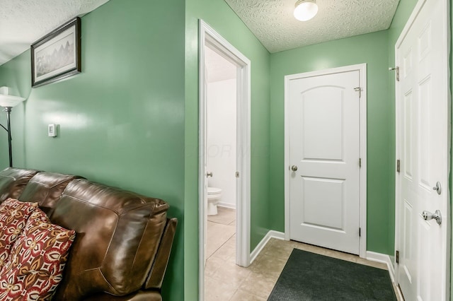 1420 Bellow Falls Pl, Columbus, OH 43228 - interior space featuring a textured ceiling, light tile patterned floors, and baseboards