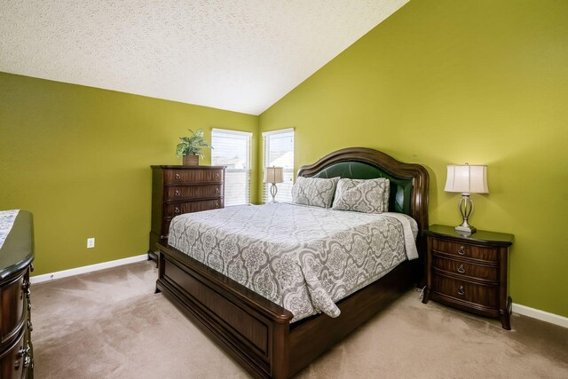 1420 Bellow Falls Pl, Columbus, OH 43228 - bedroom featuring carpet floors, baseboards, lofted ceiling, and a textured ceiling